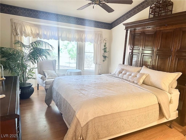 2820 Bluff Point Dr, Las Vegas, NV 89134 - bedroom featuring lofted ceiling, light wood-style floors, and ceiling fan