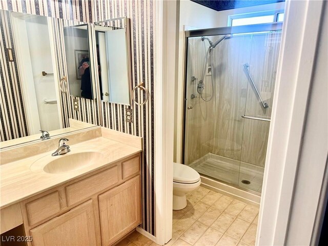 2820 Bluff Point Dr, Las Vegas, NV 89134 - full bath featuring toilet, a shower stall, wallpapered walls, and vanity