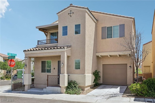 9053 Entrancing Ave, Las Vegas, NV 89149 - view of front of home with a balcony, a garage, and stucco siding