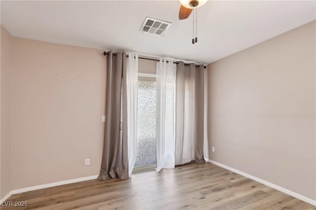 9053 Entrancing Ave, Las Vegas, NV 89149 - unfurnished room featuring wood finished floors, baseboards, and ceiling fan