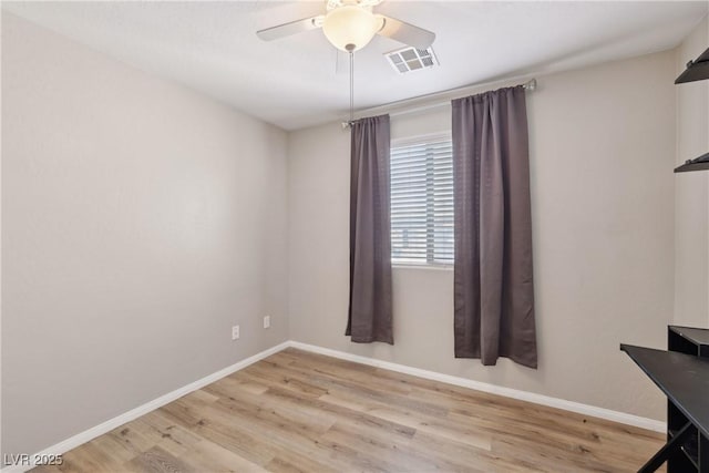 9053 Entrancing Ave, Las Vegas, NV 89149 - unfurnished room with light wood-style floors, baseboards, and a ceiling fan