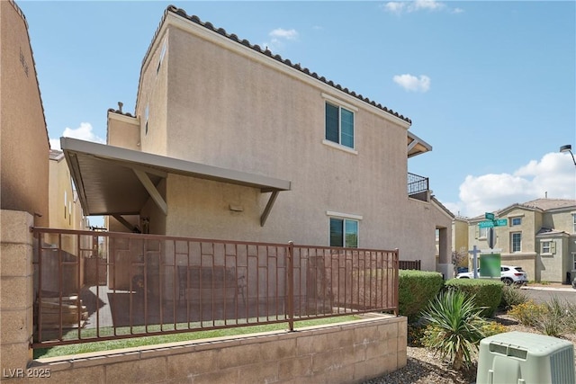 9053 Entrancing Ave, Las Vegas, NV 89149 - view of property exterior with stucco siding and a tiled roof
