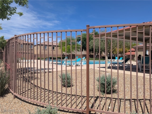 9053 Entrancing Ave, Las Vegas, NV 89149 - gate with a community pool and a patio