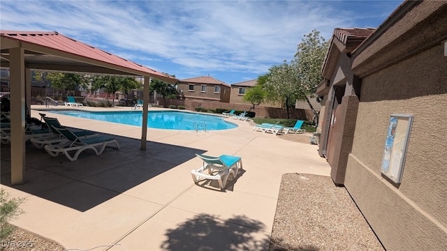 9053 Entrancing Ave, Las Vegas, NV 89149 - community pool with a fenced backyard and a patio area