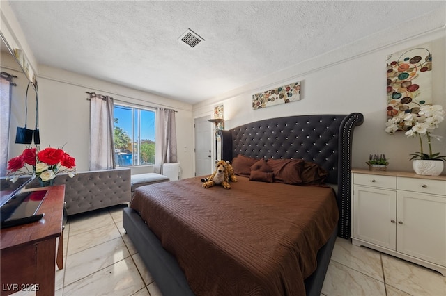 1916 Canosa Ave, Las Vegas, NV 89104 - bedroom featuring light marble finish flooring and a textured ceiling