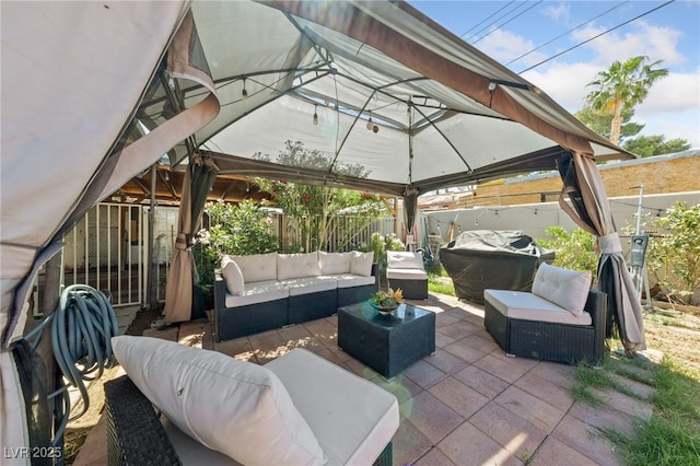 1916 Canosa Ave, Las Vegas, NV 89104 - fenced backyard with an outdoor hangout area, a gazebo, and a patio