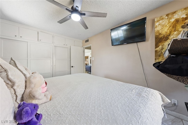 1916 Canosa Ave, Las Vegas, NV 89104 - bedroom with a textured ceiling, a ceiling fan, and marble finish flooring