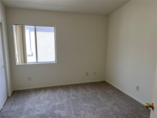 6462 Saddle Up Ave Unit 103, Henderson, NV 89011 - spare room featuring carpet flooring and baseboards