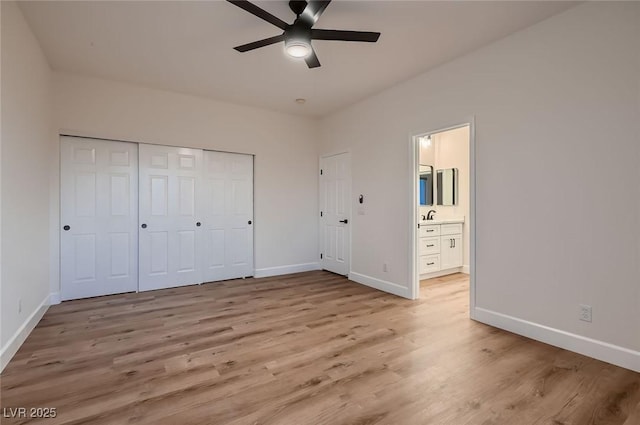 2448 Ram Crossing Way, Henderson, NV 89074 - unfurnished bedroom featuring light wood-style flooring, baseboards, and a closet