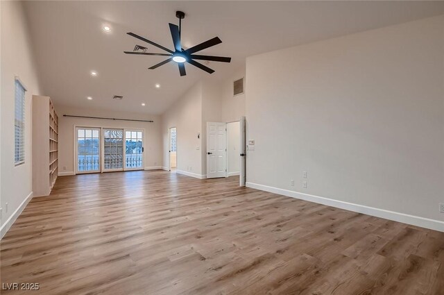 2448 Ram Crossing Way, Henderson, NV 89074 - unfurnished living room featuring high vaulted ceiling, baseboards, ceiling fan, wood finished floors, and recessed lighting