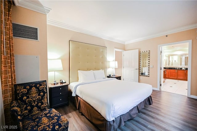 135 E Harmon Ave Unit 2420, Las Vegas, NV 89109 - bedroom with wood finished floors, ornamental molding, and ensuite bathroom