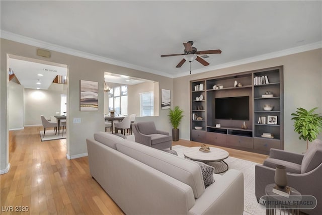 2529 Flodden St, Henderson, NV 89044 - living area with crown molding, a ceiling fan, light wood-style flooring, and baseboards