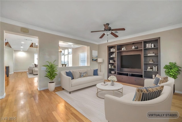 2529 Flodden St, Henderson, NV 89044 - living area with ceiling fan, light wood-style floors, crown molding, and baseboards