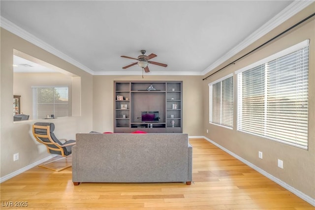 2529 Flodden St, Henderson, NV 89044 - living area with ceiling fan, light wood-style floors, baseboards, and ornamental molding