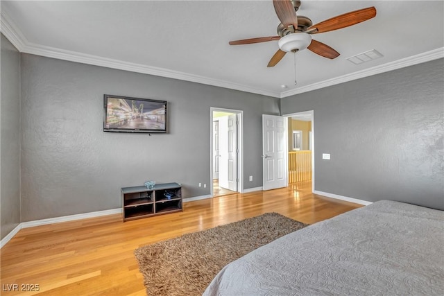 2529 Flodden St, Henderson, NV 89044 - bedroom with wood finished floors, crown molding, baseboards, and a ceiling fan