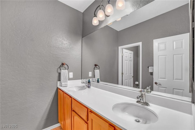 2529 Flodden St, Henderson, NV 89044 - bathroom featuring a textured wall and double vanity