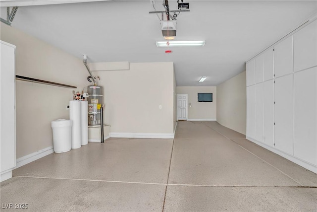 2529 Flodden St, Henderson, NV 89044 - garage featuring secured water heater, baseboards, and a garage door opener
