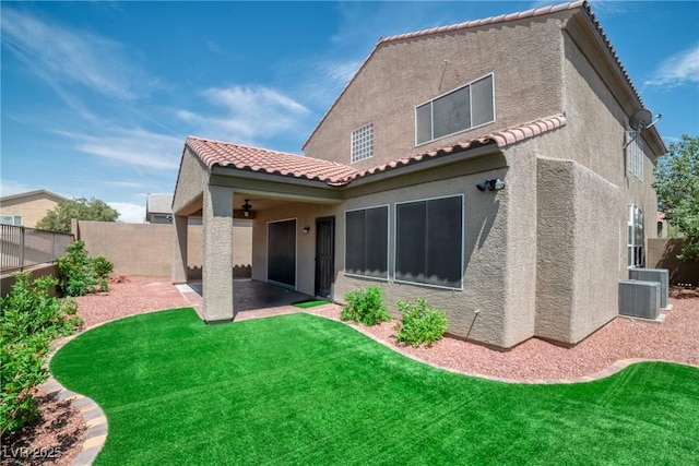 2529 Flodden St, Henderson, NV 89044 - rear view of house with stucco siding, a tiled roof, a patio, and central AC
