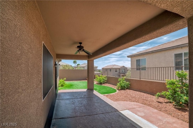 2529 Flodden St, Henderson, NV 89044 - fenced backyard featuring a ceiling fan and a patio area