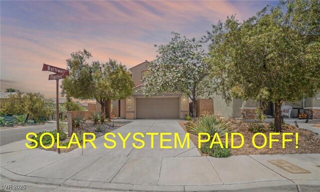2529 Flodden St, Henderson, NV 89044 - view of front of house with concrete driveway and stucco siding