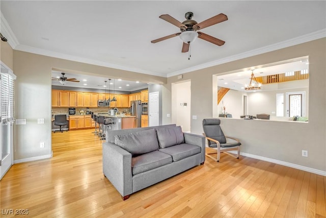2529 Flodden St, Henderson, NV 89044 - living area featuring light wood-style flooring, ceiling fan, baseboards, ornamental molding, and recessed lighting