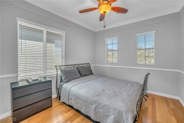 2529 Flodden St, Henderson, NV 89044 - bedroom with wood finished floors, crown molding, baseboards, and a ceiling fan