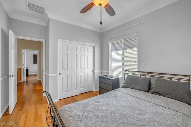 2529 Flodden St, Henderson, NV 89044 - bedroom with light wood finished floors, ornamental molding, a closet, baseboards, and ceiling fan