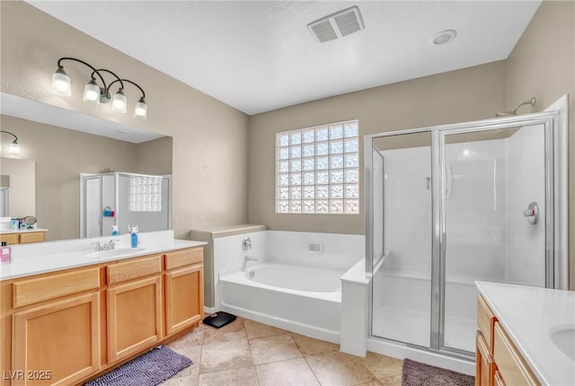 2529 Flodden St, Henderson, NV 89044 - bathroom with vanity, a stall shower, and a garden tub