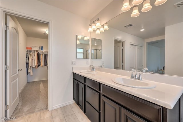 12286 Silvana St, Las Vegas, NV 89141 - full bath with double vanity, baseboards, and a spacious closet