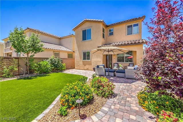 12286 Silvana St, Las Vegas, NV 89141 - back of property featuring an outdoor hangout area, stucco siding, a patio, and a tile roof