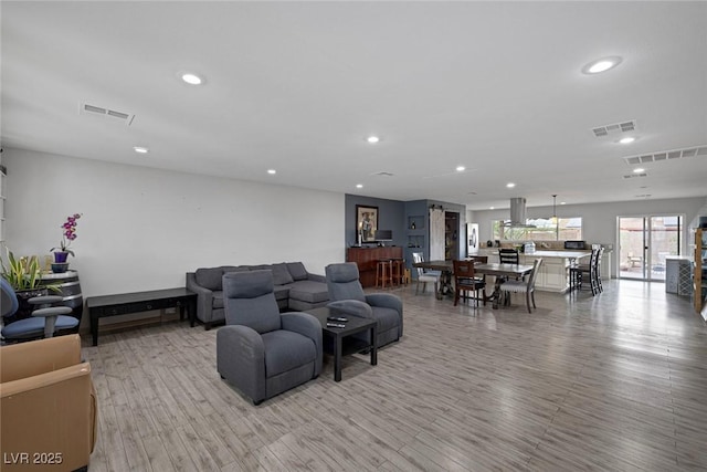 603 Palmhurst Dr, Las Vegas, NV 89145 - living area featuring recessed lighting and light wood-style flooring