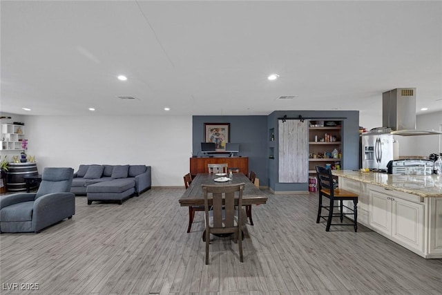603 Palmhurst Dr, Las Vegas, NV 89145 - dining space featuring recessed lighting, light wood-style flooring, and baseboards