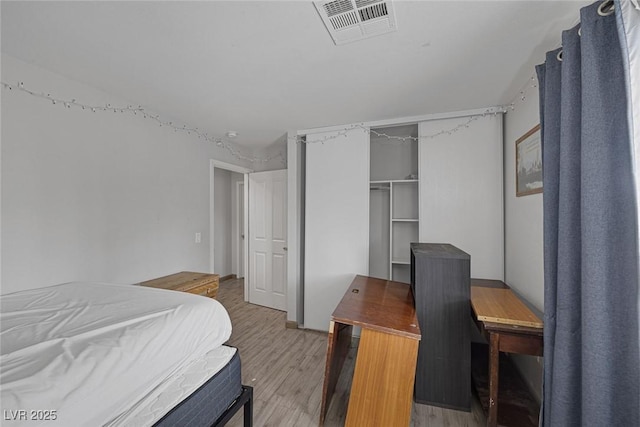 603 Palmhurst Dr, Las Vegas, NV 89145 - bedroom with light wood finished floors and a closet