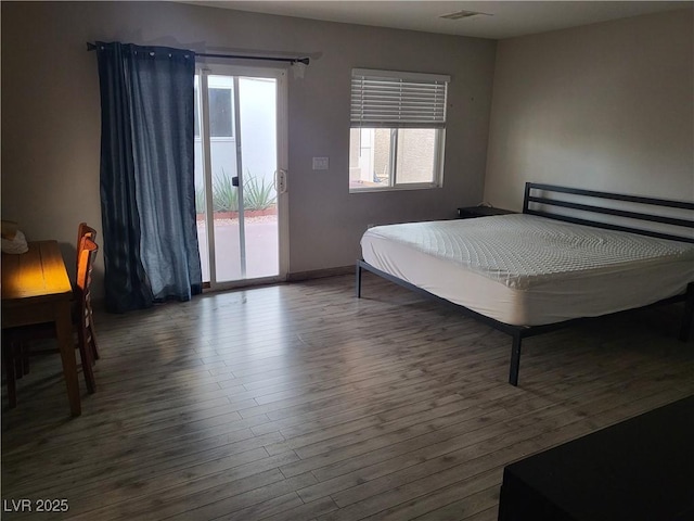 603 Palmhurst Dr, Las Vegas, NV 89145 - bedroom with access to outside and wood finished floors