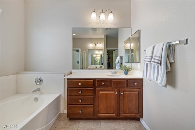 820 Colina Alta Pl, Las Vegas, NV 89138 - bathroom with vanity, a garden tub, tile patterned flooring, baseboards, and a shower with door