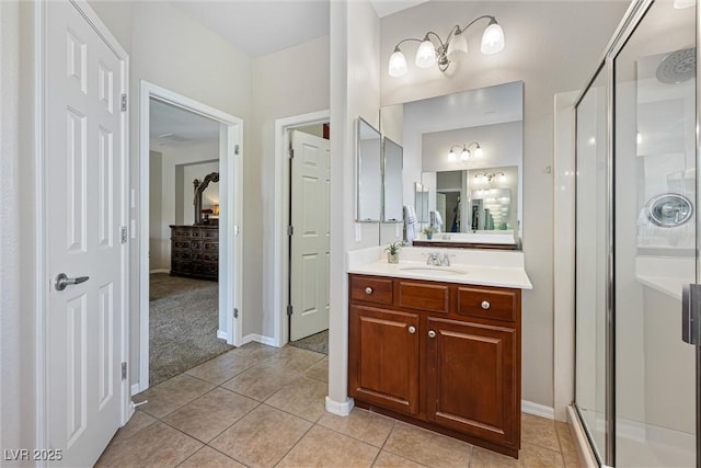 820 Colina Alta Pl, Las Vegas, NV 89138 - ensuite bathroom with a shower stall, vanity, tile patterned flooring, and baseboards