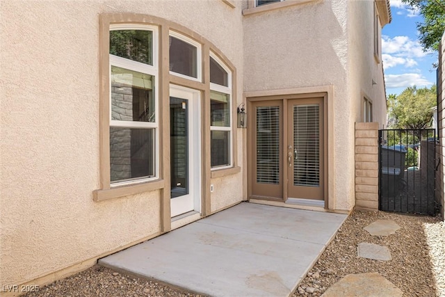 820 Colina Alta Pl, Las Vegas, NV 89138 - view of exterior entry featuring stucco siding, a patio area, and a gate