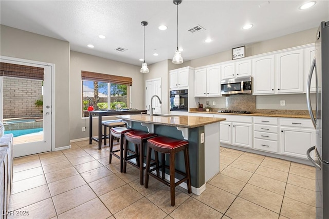 820 Colina Alta Pl, Las Vegas, NV 89138 - kitchen with black appliances, a sink, white cabinetry, and recessed lighting
