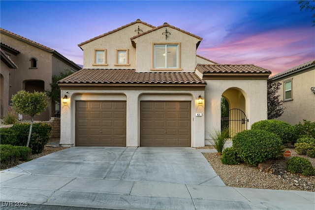 820 Colina Alta Pl, Las Vegas, NV 89138 - mediterranean / spanish-style home featuring stucco siding, a garage, concrete driveway, and a tile roof