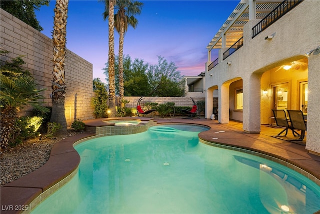 820 Colina Alta Pl, Las Vegas, NV 89138 - pool at dusk featuring a fenced backyard, a patio area, and a pool with connected hot tub