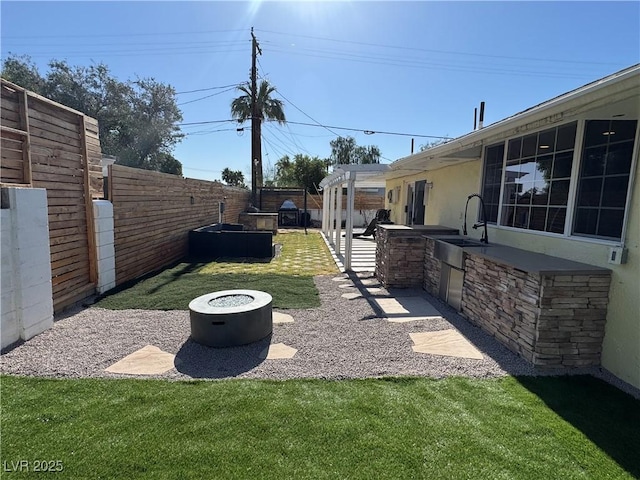 1819 Beverly Way, Las Vegas, NV 89104 - view of yard featuring a sink, an outdoor kitchen, and a patio area