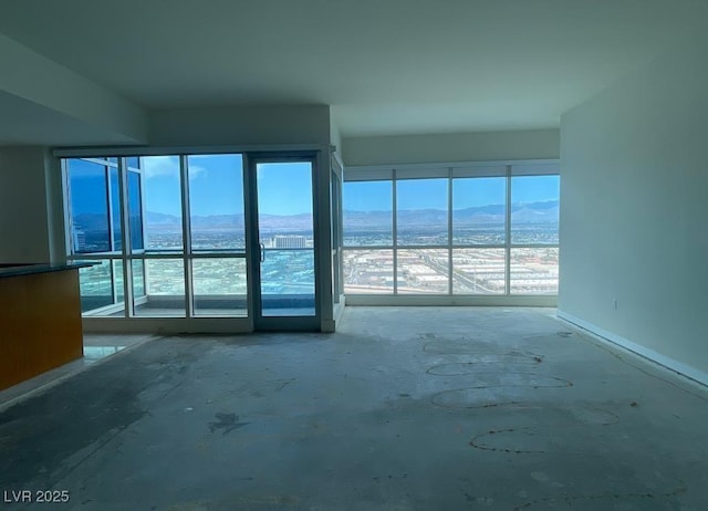 4575 Dean Martin Dr Unit 3206, Las Vegas, NV 89103 - spare room featuring a mountain view and baseboards