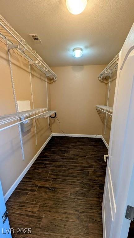 8159 Base Camp Ave, Las Vegas, NV 89178 - walk in closet featuring wood finished floors