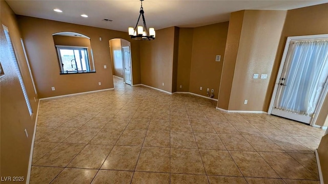 8159 Base Camp Ave, Las Vegas, NV 89178 - tiled spare room featuring arched walkways, a chandelier, recessed lighting, and baseboards