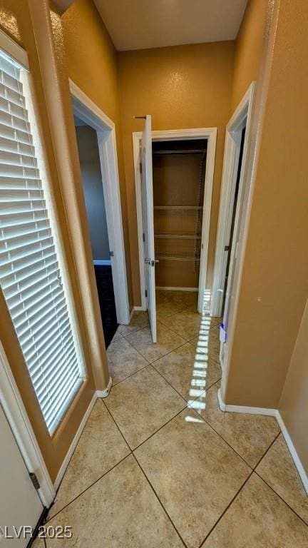 8159 Base Camp Ave, Las Vegas, NV 89178 - corridor with light tile patterned flooring and baseboards