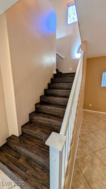 8159 Base Camp Ave, Las Vegas, NV 89178 - stairs featuring plenty of natural light, tile patterned flooring, and baseboards