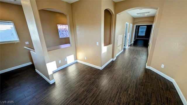 8159 Base Camp Ave, Las Vegas, NV 89178 - corridor featuring dark wood-type flooring and arched walkways