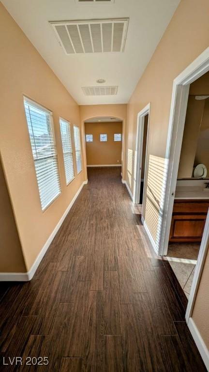 8159 Base Camp Ave, Las Vegas, NV 89178 - corridor with dark wood-style floors and arched walkways