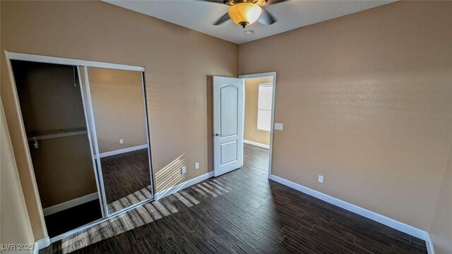 8159 Base Camp Ave, Las Vegas, NV 89178 - unfurnished bedroom with dark wood-style floors, a closet, and a ceiling fan