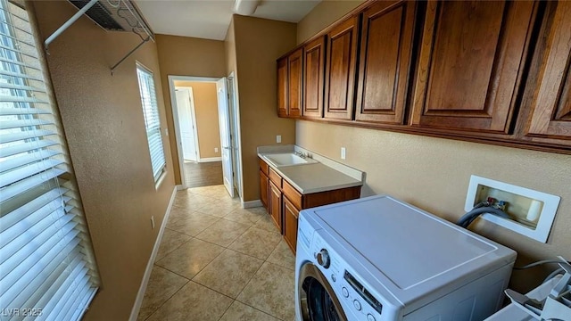 8159 Base Camp Ave, Las Vegas, NV 89178 - laundry room with washer / dryer, cabinet space, light tile patterned floors, and a textured wall